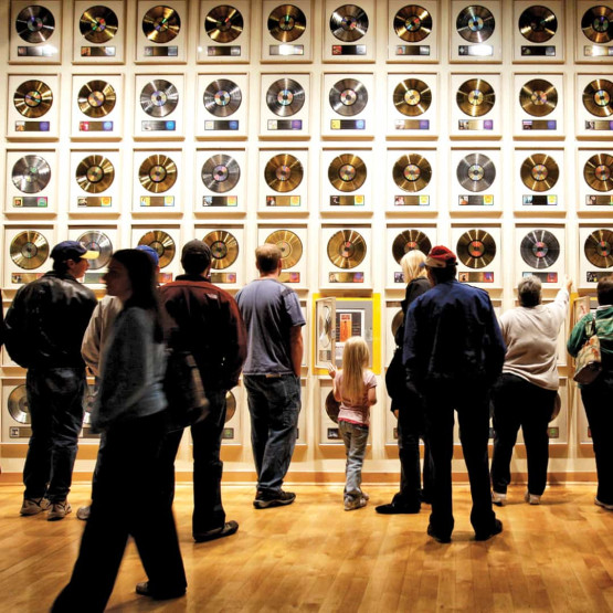 girls weekend in Nashville - How to Spend a Girls Weekend in Nashville Wall with golden records at the Country Music Hall of Fame in Nashville, USA.