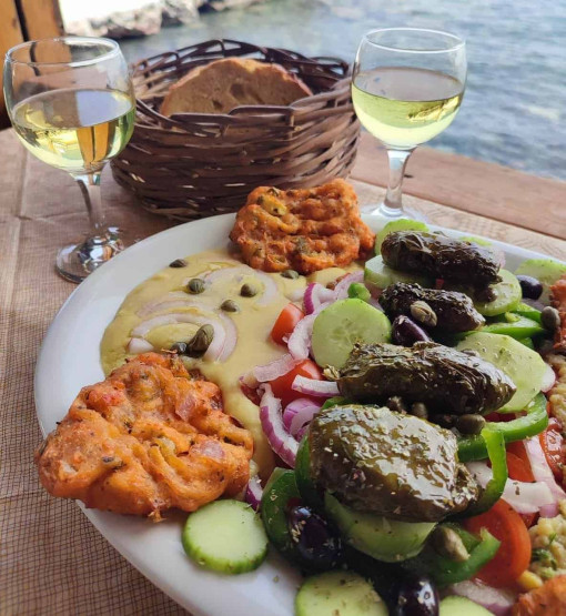 Romantic Sunset Restaurants in Santorini - How to Reserve the Best Romantic Sunset Restaurants in Santorini, Greece Delicious meal at the restaurant Cave of Nicolas - Vegan Food Tour in Santorini, Greece.