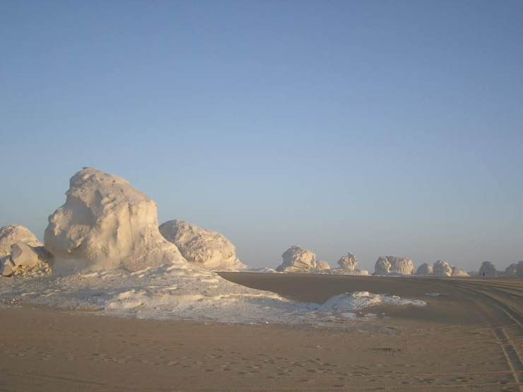 - English Mountain in Bahariya Oasis, Egypt White desert at dawn in Bahariya, Egypt - Photo by Paul Nendick via Flickr.