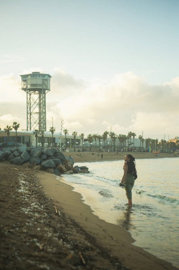 Places to Take Photos in Barcelona - The Best Places to Take Photos in Barcelona Walking along the beach in Barceloneta, Barcelona, Spain.