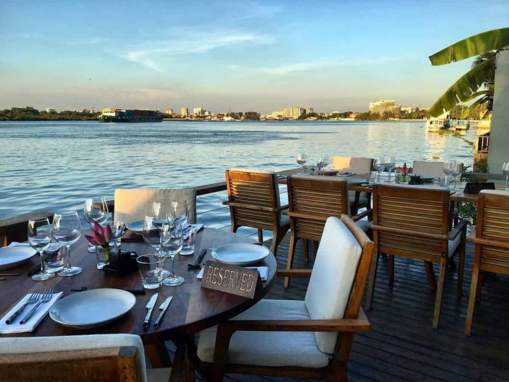 neighborhoods in Ho Chi Minh - A Foodie Guide to the Different Neighborhoods in Ho Chi Minh City Restaurant at the river at the District 2 in Ho Chi Minh City, Vietnam.