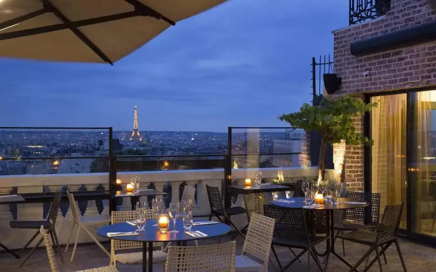 View of the Eiffel Tower - Top Paris Restaurants with a View of the Eiffel Tower View onto the Eiffel Tower from the Terrass Hotel Restaurant in Paris, France.