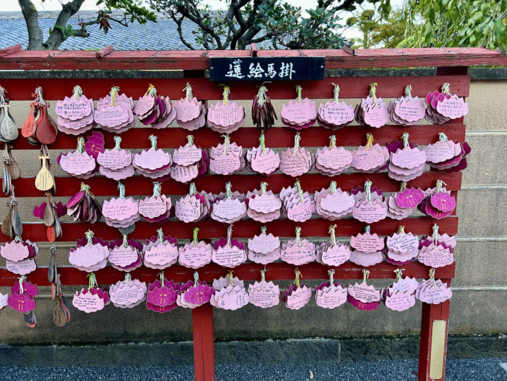 Travel Tips for Tokyo and Kyoto - Top Travel Tips for Tokyo and Kyoto Making wishes at the Benten-in temple in Ueno Park in Tokyo, Japan.