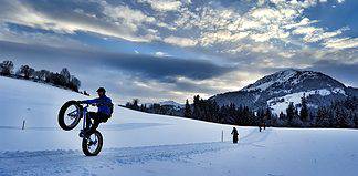 Different Fun Things To Do in Winter in Austria Wheelie with a Fat Bike in the Austrian Alps.