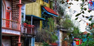 Hanoi in Ten Stops, From Hoan Kiem Lake to Bat Trang Old colorful houses in Hanoi, Vietnam.