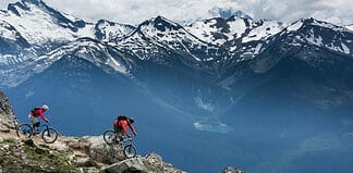 Best Mountain Biking Destinations in North America Mountain Bike riders in Whistler mountains, British Columbia