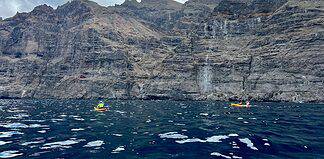Six Top Tenerife Adventure Shore Experiences with P&O Cruises Fly Canaries Sea kayaking around the Los Gigantes cliffs in Tenerife, Spain.