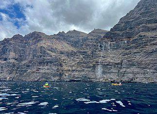 Six Top Tenerife Adventure Shore Experiences with P&O Cruises Fly Canaries Sea kayaking around the Los Gigantes cliffs in Tenerife, Spain.