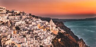 How to Reserve the Best Romantic Sunset Restaurants in Santorini, Greece Sunset at the Caldera in Santorini, Greece.