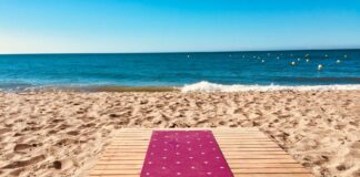 4 Unforgettable Yoga Retreats in Spain Yoga on the beach.