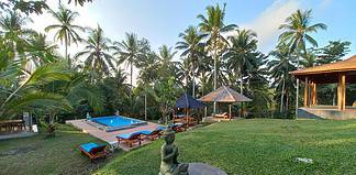 Unforgettable Yoga Retreats in Bali Garden and pool at the Bali Green Retreat, Indonesia.