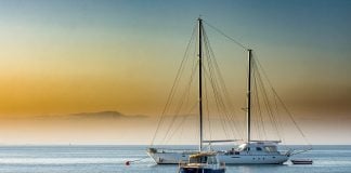 Great Mediterranean Sailing Routes for Beginners Boats at the blue hour at the Turkish coast in the Mediterranean sea.