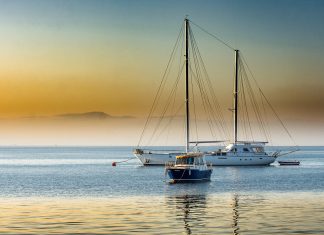 Great Mediterranean Sailing Routes for Beginners Boats at the blue hour at the Turkish coast in the Mediterranean sea.