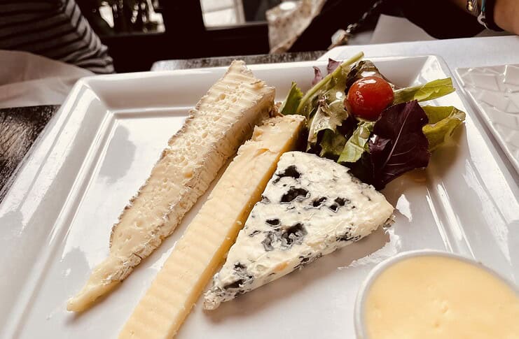 How to Eat Like a Local in Paris Slices of different French cheese.