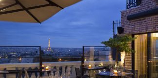 Top Paris Restaurants with a View of the Eiffel Tower View onto the Eiffel Tower from the Terrass Hotel Restaurant in Paris, France.