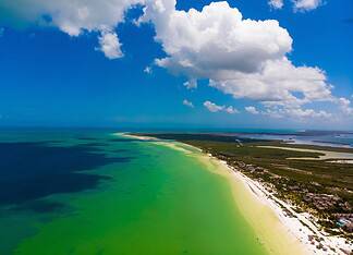 Cancun’s Island Get Away: Discover the Best Routes from Cancun to Holbox and Isla Mujeres Drone pic of the beach of Holbox in Quintana Roo, Mexico.