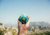 What Travel Teaches You That Nothing Else Can Travel the world - Globe in the hands. pexels-nurseryart-346885
