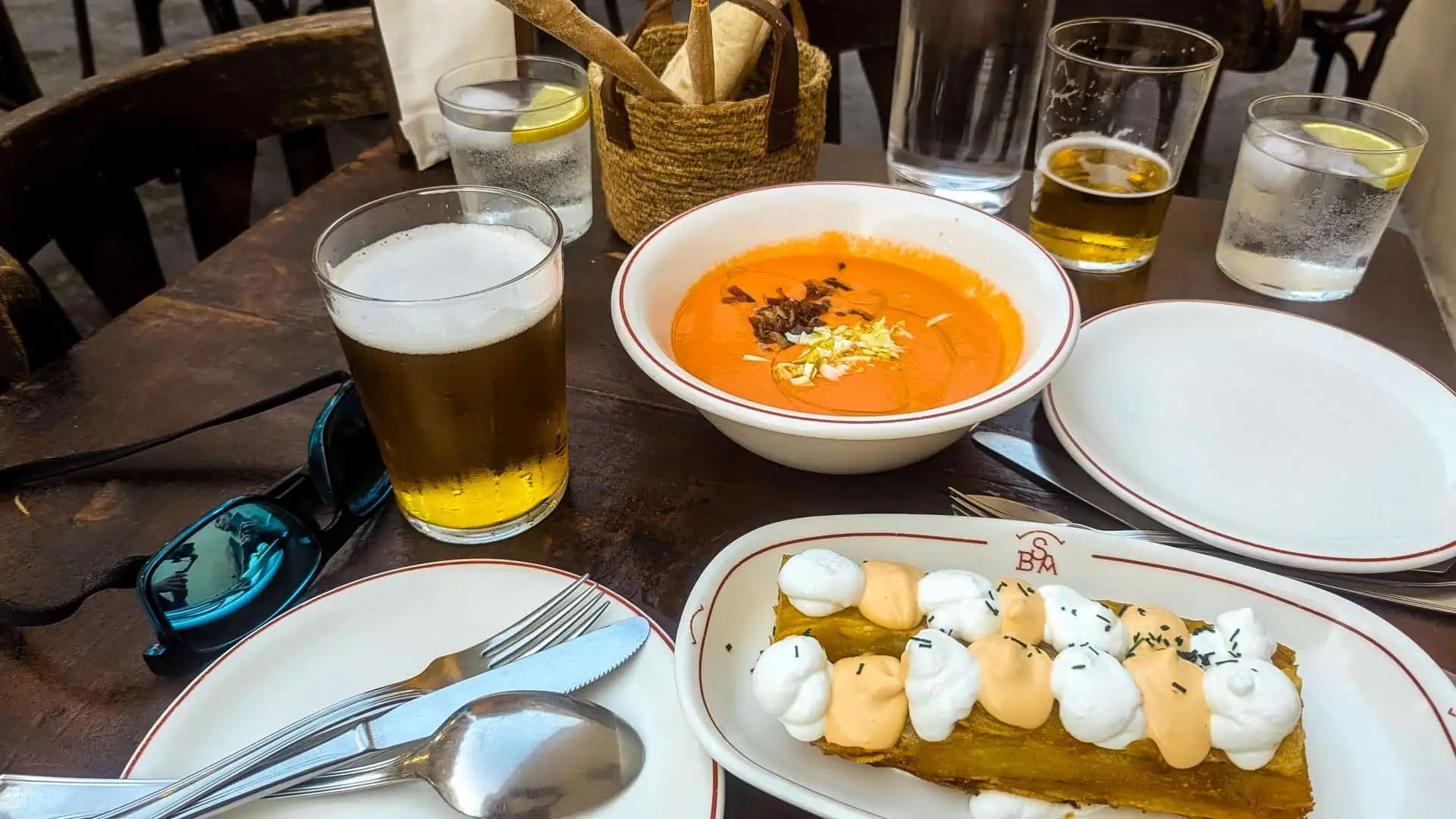 - Discover Seville’s Culinary Heart Through Tapas Beer and tapas at Bar Santa Ana in Seville, Spain.