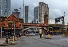 Best Travel Hacks That Will Actually Save You Money in Manchester Pub and bridge in Castlefield, Manchester, United Kingdom.