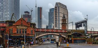 Best Travel Hacks That Will Actually Save You Money in Manchester Pub and bridge in Castlefield, Manchester, United Kingdom.