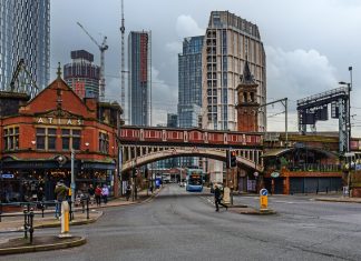 Best Travel Hacks That Will Actually Save You Money in Manchester Pub and bridge in Castlefield, Manchester, United Kingdom.