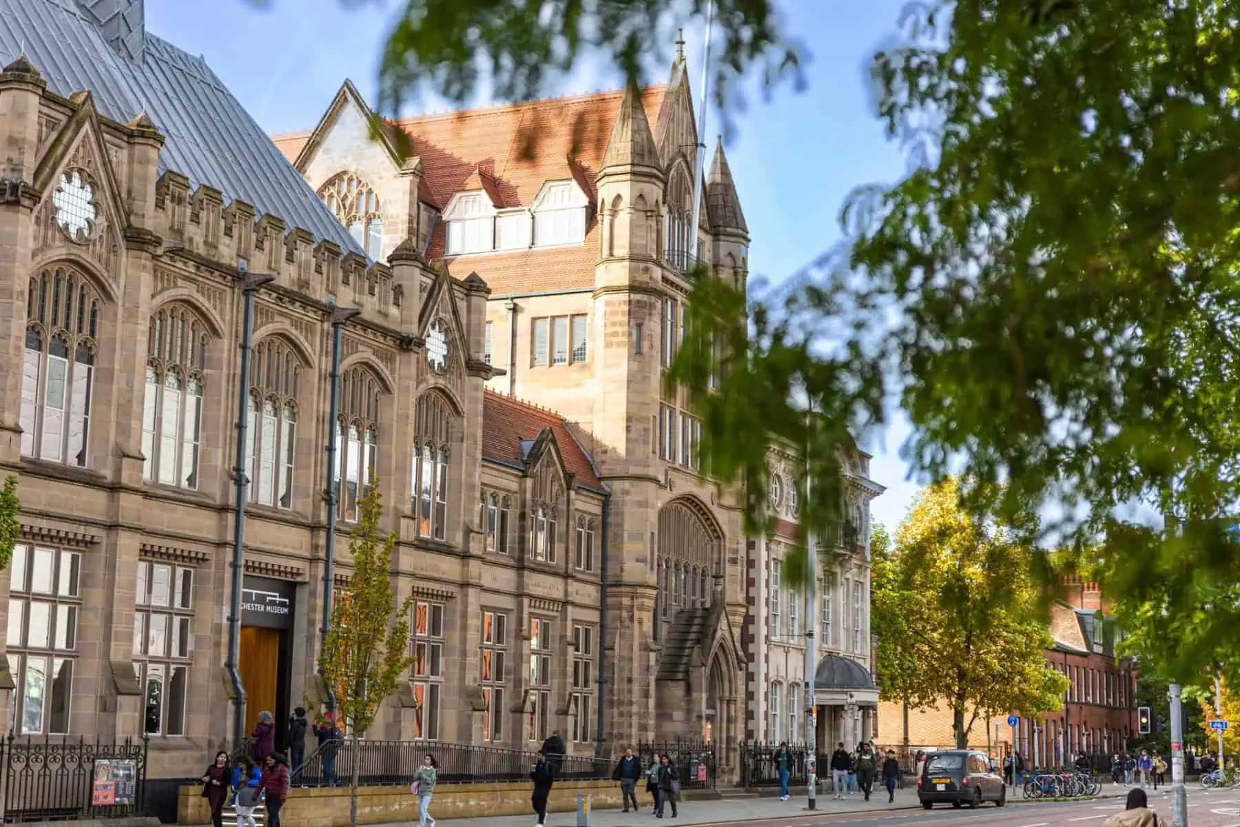 The exterior of Manchester Museum seen from the opposite side of Oxford Road.