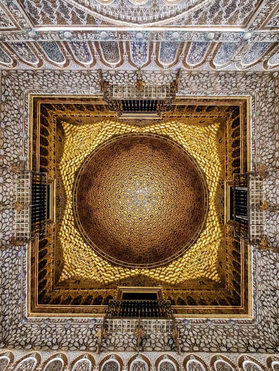 - Discover the Royal Alcazar of Seville: Get an Exclusive Early Access The ceiling at the Hall of the Ambassadors of the Alcazar in Seville, Spain. Becki Rendell from TheSevilleGuide.com.