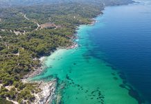 Hiking Trails in Northern Greece: A Story of Gods, Gorges, and Goats A view from above at the majestic beach of Kavourotrypes, located in Sithonia, Halkidiki, Greece