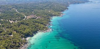 Hiking Trails in Northern Greece: A Story of Gods, Gorges, and Goats A view from above at the majestic beach of Kavourotrypes, located in Sithonia, Halkidiki, Greece