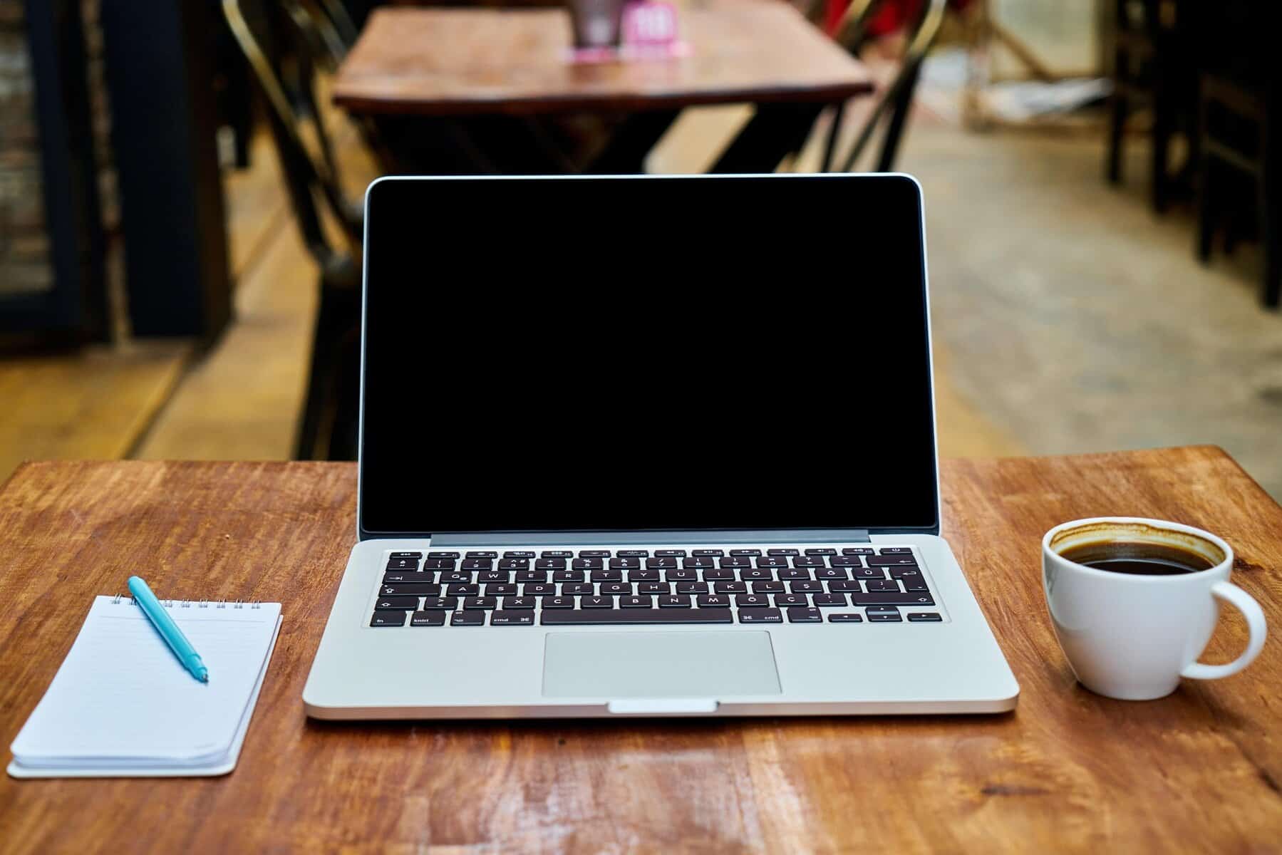 Coffee and laptop - digital nomad lifestyle.