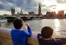 How to Spend a Weekend in London with Kids Boys looking over the thames at big ben and london bridge