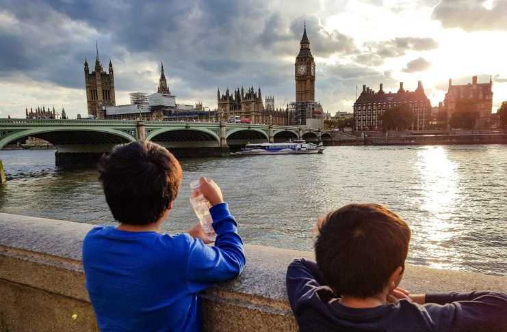 How to Spend a Weekend in London with Kids Boys looking over the thames at big ben and london bridge