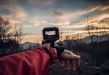 Travel Videos: A Beginner’s Guide to Creating Travel Stories That Captivate GoPro camera filming a sunset.