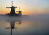 Navigating Internet Access in the Netherlands: A Traveler’s Guide Mills at sunrise in the Netherlands.