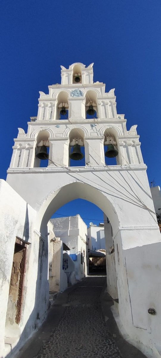 Medieval Santorini Villages - Medieval Santorini Villages: Where the Island Finally Slows Down Medieval villages in Santorini featuring Megalochori bell tower and cobbled streets