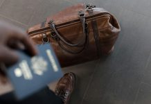 Business Travel Statistics 2026: Global Market Analysis and Spending Trends Brown leather duffel bag. Pic via nappy -pexels