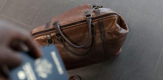 Business Travel Statistics 2026: Global Market Analysis and Spending Trends Brown leather duffel bag. Pic via nappy -pexels