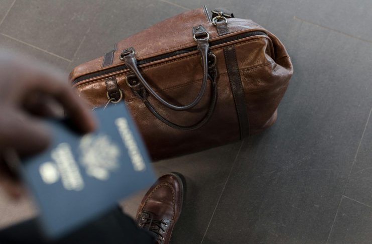 Business Travel Statistics 2026: Global Market Analysis and Spending Trends Brown leather duffel bag. Pic via nappy -pexels