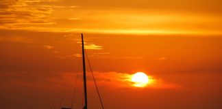 Corporate Events and Team Building on Mallorca Yachts Catamaran in Mallorca at sunset.