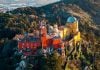 Which Sintra Tour Should You Book? Half-Day vs. Full-Day Pena Palace in Sintra Portugal surrounded by lush forest and romantic architecture