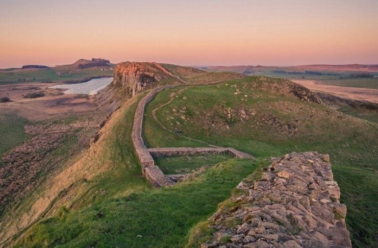 Where the Roman Empire Ends: Walking Hadrian’s Wall’s Wildest Section Hadrian's Wall, Brampton, UK. Wall snaking across crags. Pic via jonny-gios -unsplash