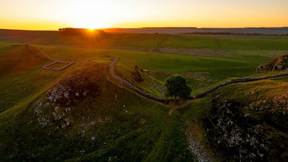 - Where the Roman Empire Ends: Walking Hadrian’s Wall’s Wildest Section Sycamore Gap with the now cut down tree, Northumberland National Park, Once Brewed, Hexham, UK. Pic via mark-mc-neill -unsplash