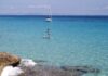 What to Do on a Day Trip or Short Stay in Formentera from Ibiza SUP and sailing yacht in Formentera, Spain.