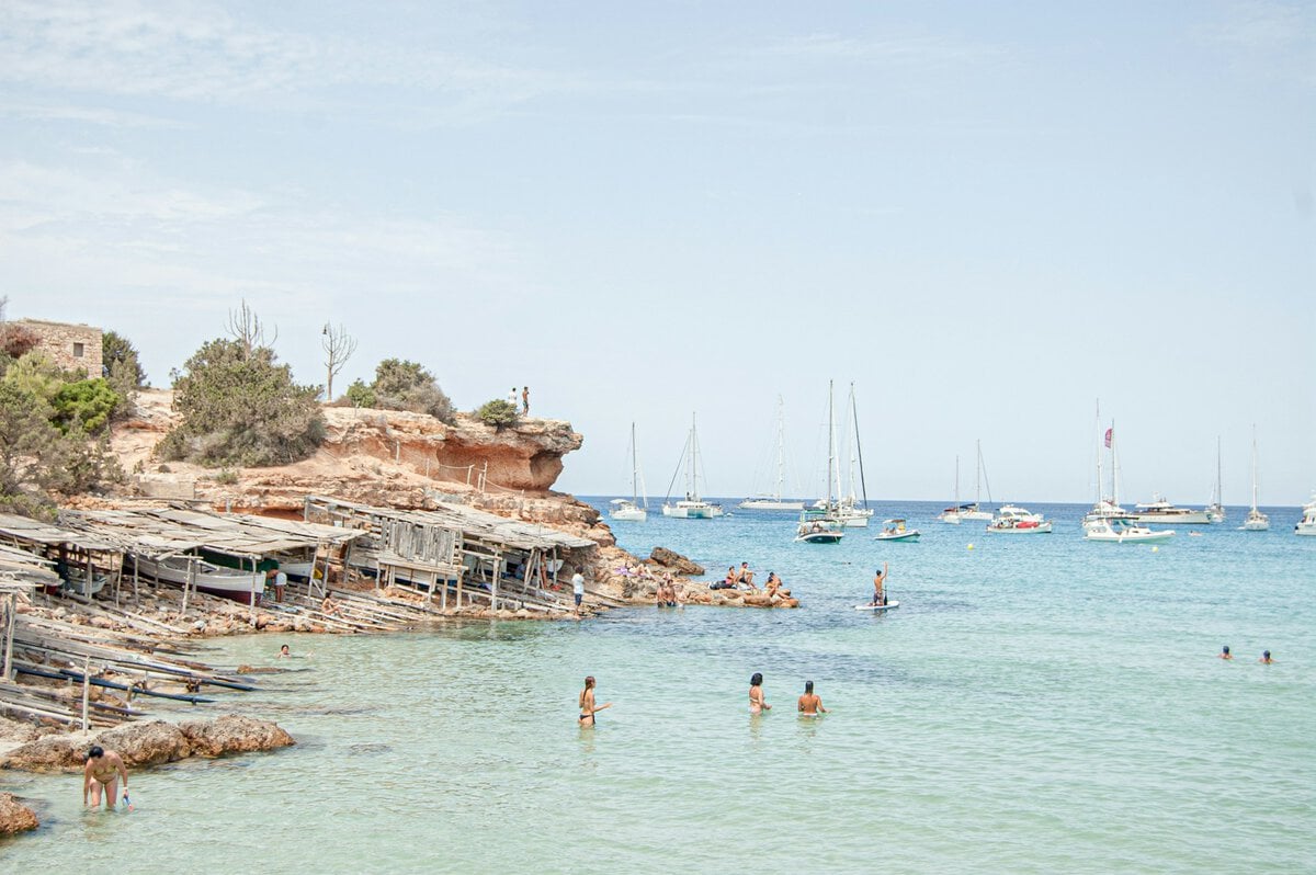 Small fishing boats at the beach in Formentera, Spain. Pic via ferran-feixas -unsplash