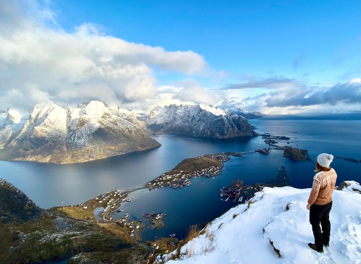Woman at the top of Reinebringen in Lofoten, Northern Norway