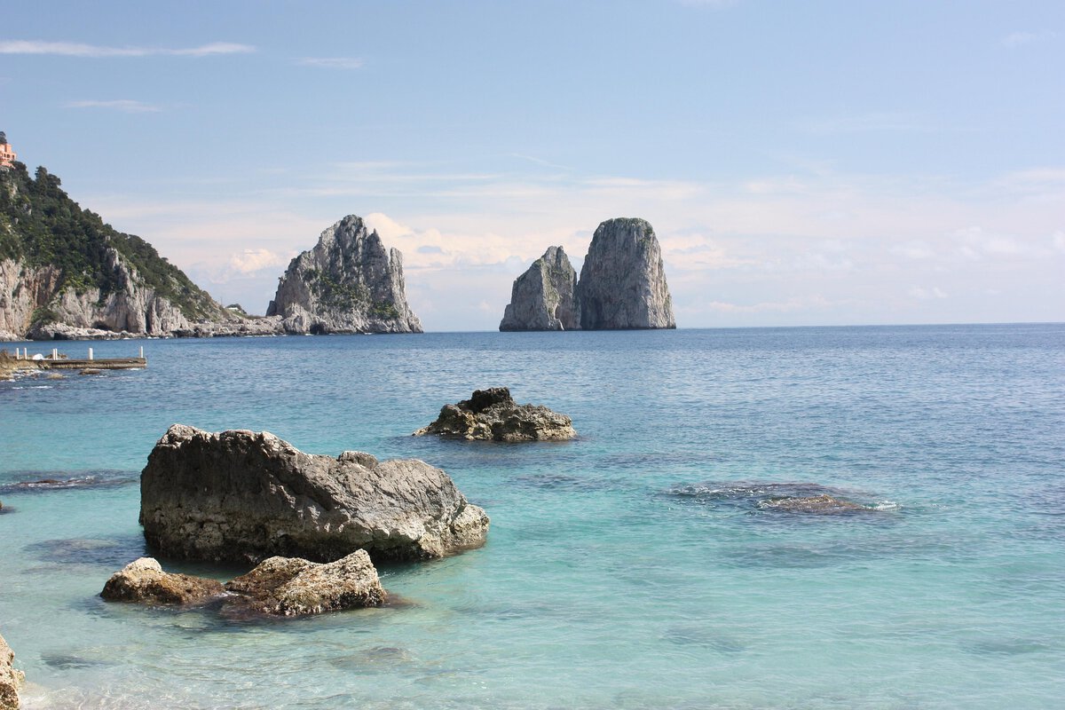 where to see the Faraglioni - Waking Up to the Faraglioni: Capri's View That Never Gets Old The Faraglioni in Capri, Italy.
